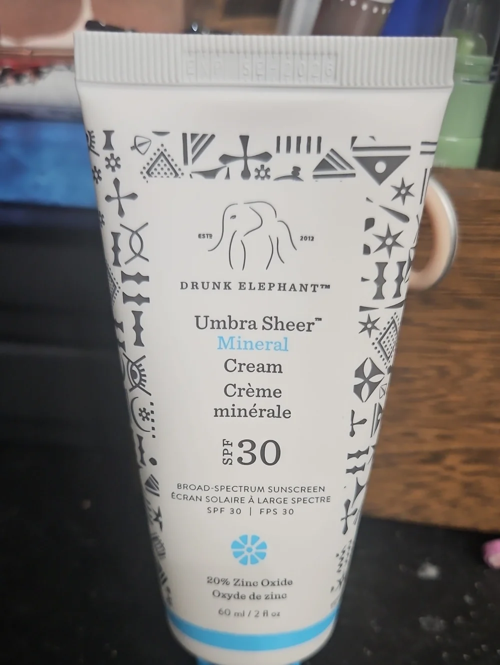 Drunk Elephant Umbra Sheer Mineral Cream SPF 30 — White with Blue Accents